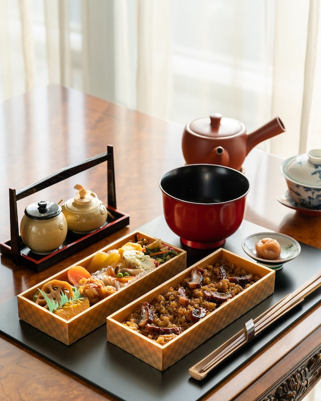 An intricate bento box which features seasonal ingredients, served with tea and umeboshi. 