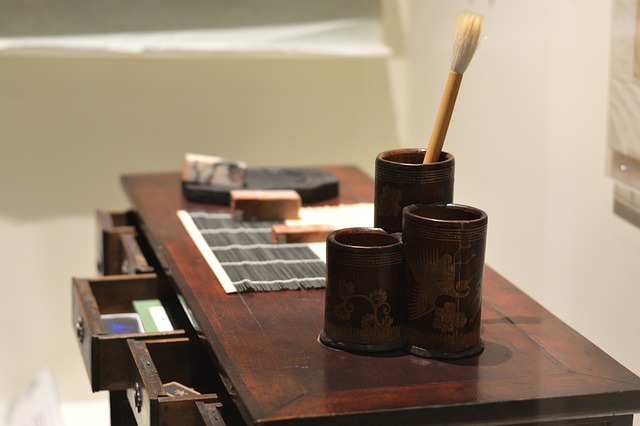 A calligrapher's worktable featuring the traditional tools used in Japanese calligraphy