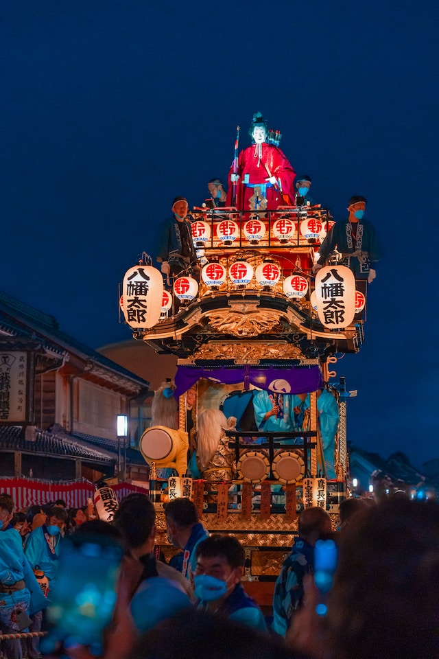 A float is being paraded as part of a Japanese matsuri celebration