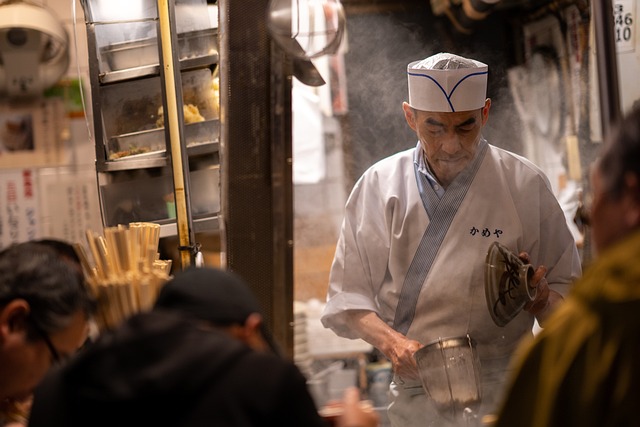 Chef cooking ramen for his customers