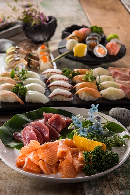 An assortment of sushi and sashimi on a wooden table