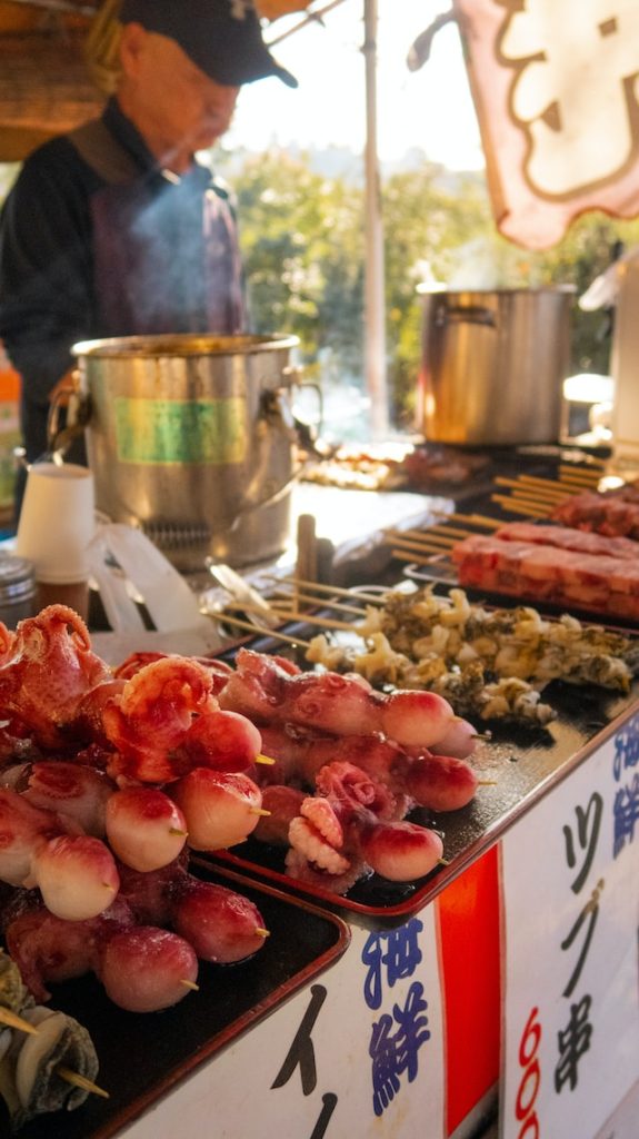 A street food stall with an assortment of Japanese street food staples