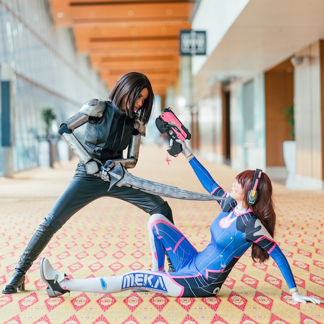 Two cosplayers acting out a scene